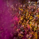 Locals including Hindu widows throw flower petals and colored powder at the Gopinath temple in Vrindavan. (AP Photo /Manish Swarup)